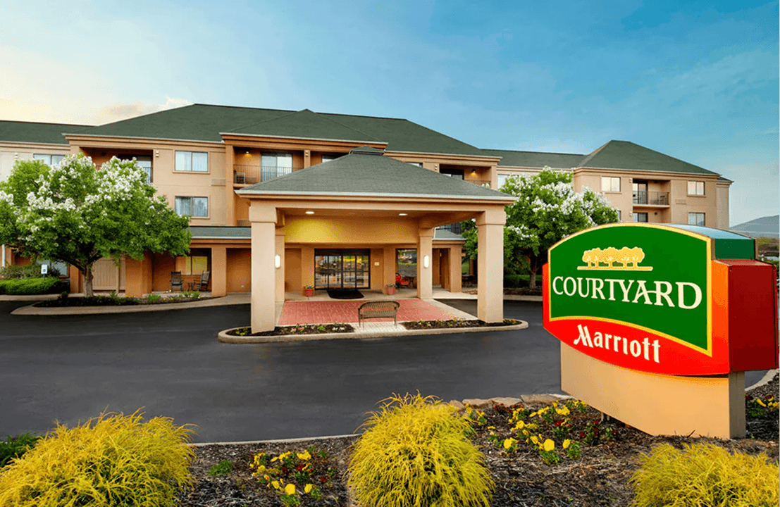 Courtyard by Marriott hotel exterior with sign.