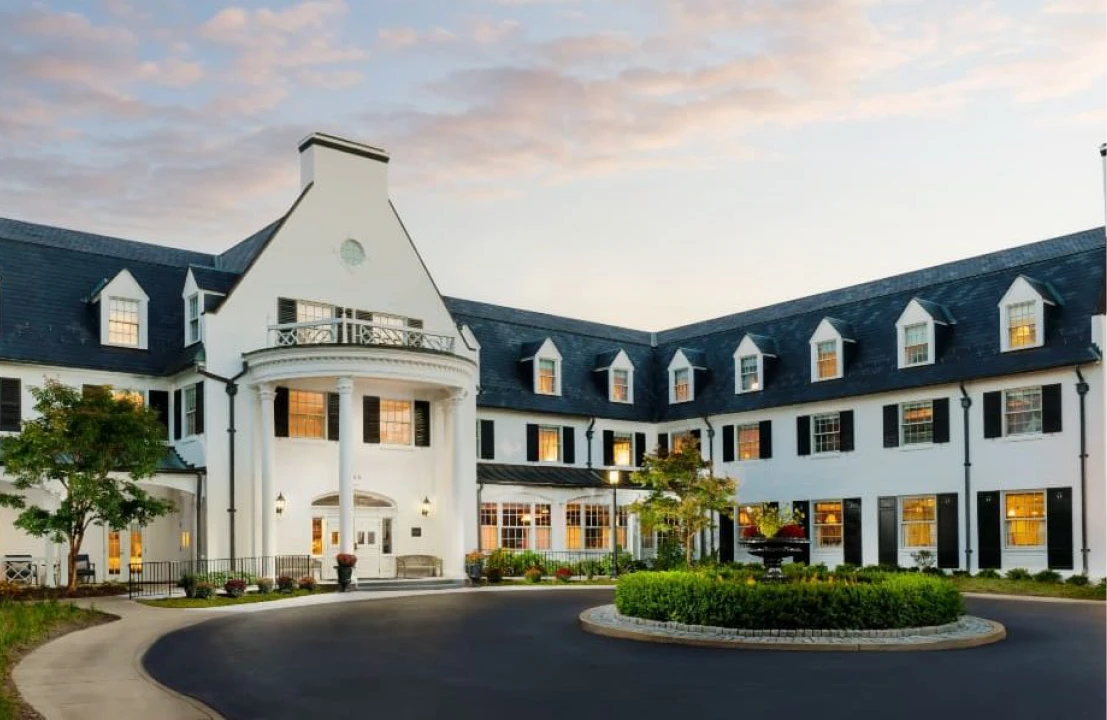 Elegant hotel exterior with circular driveway.