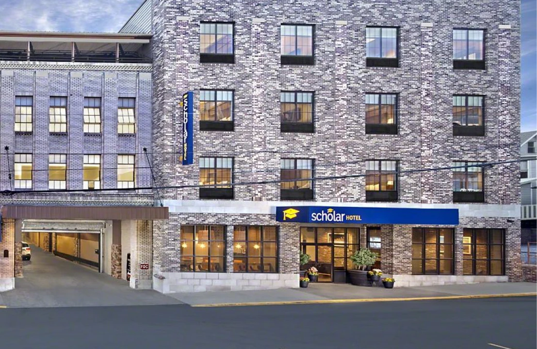 Elegant hotel exterior with circular driveway.