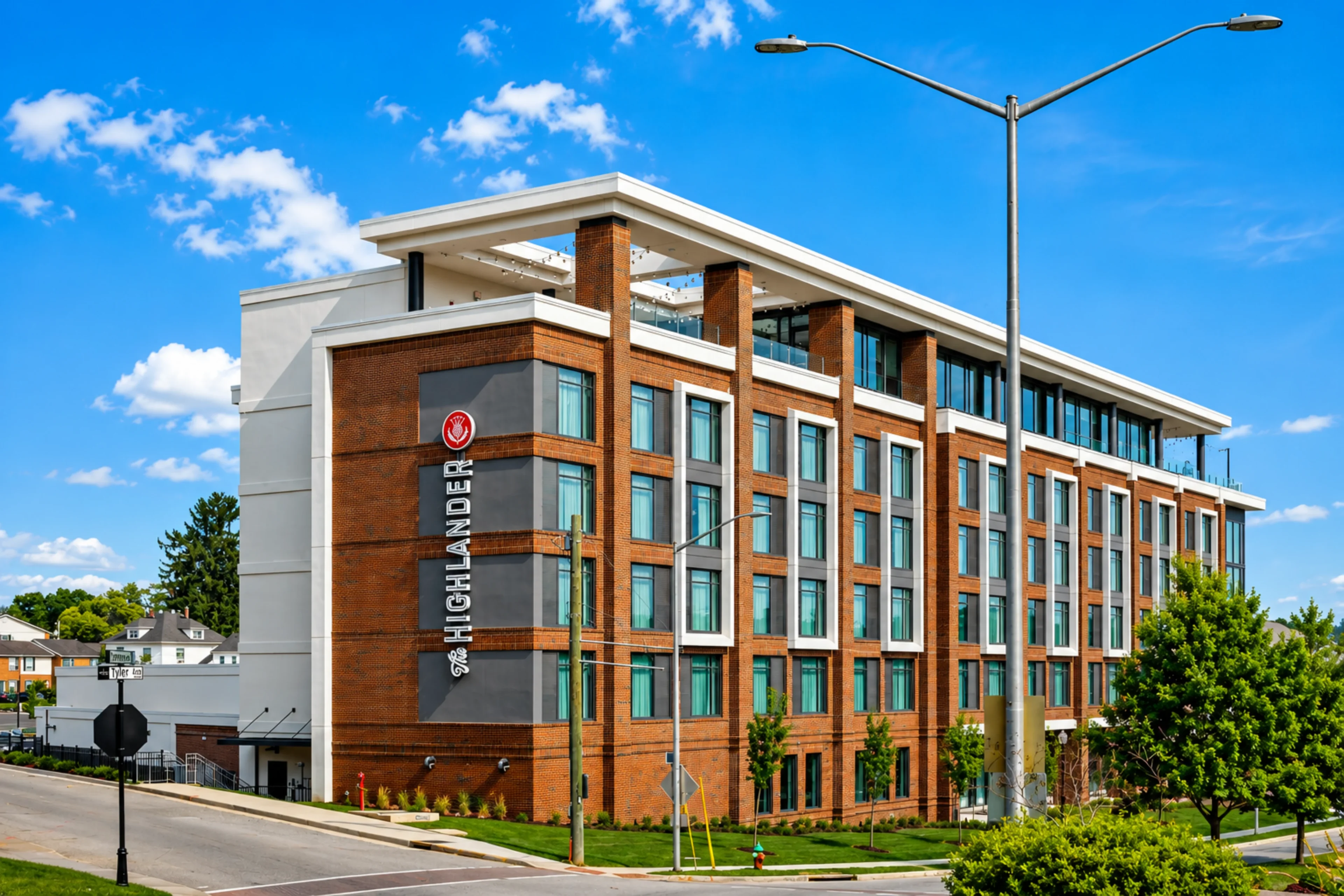 Modern brick building with large windows, daytime.