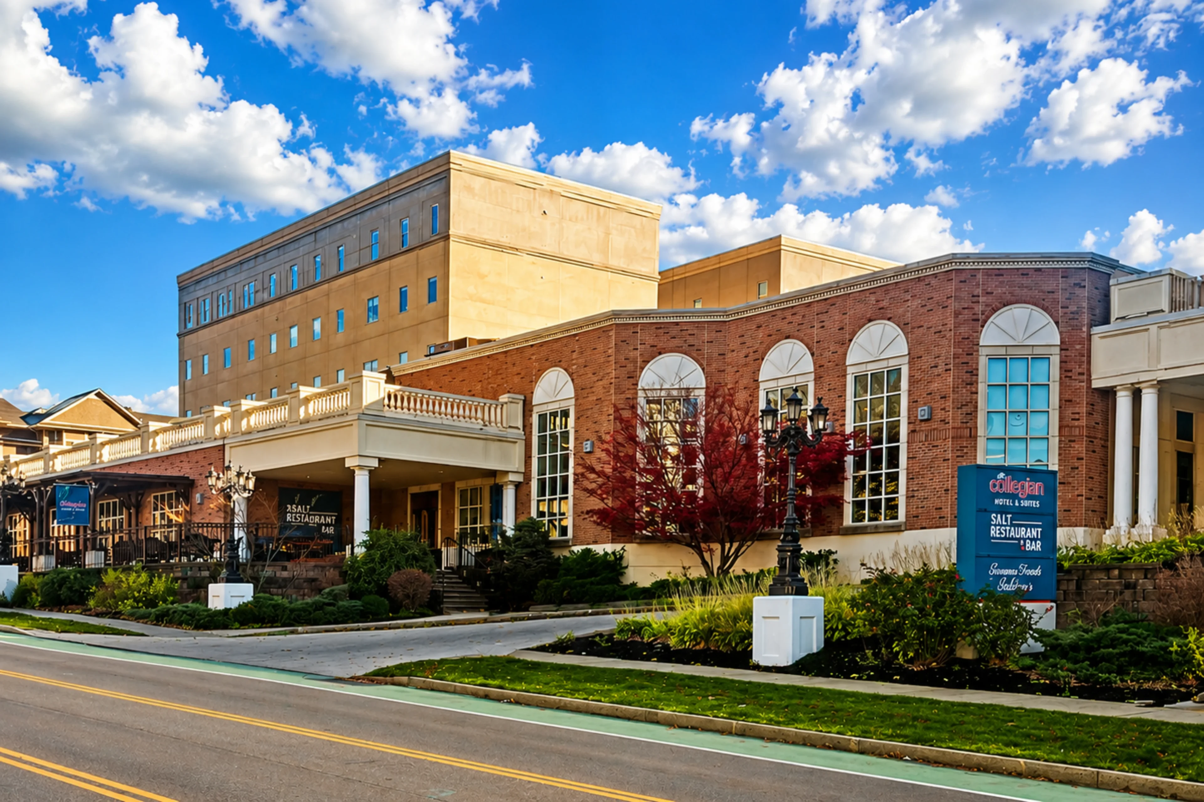 Brick building with arched windows, blue sky.