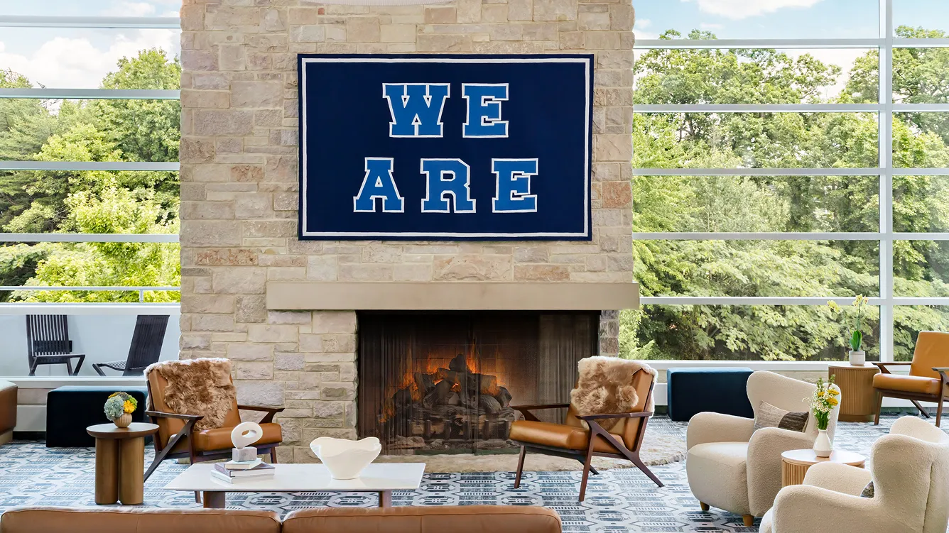 Modern lounge with "We Are" sign.