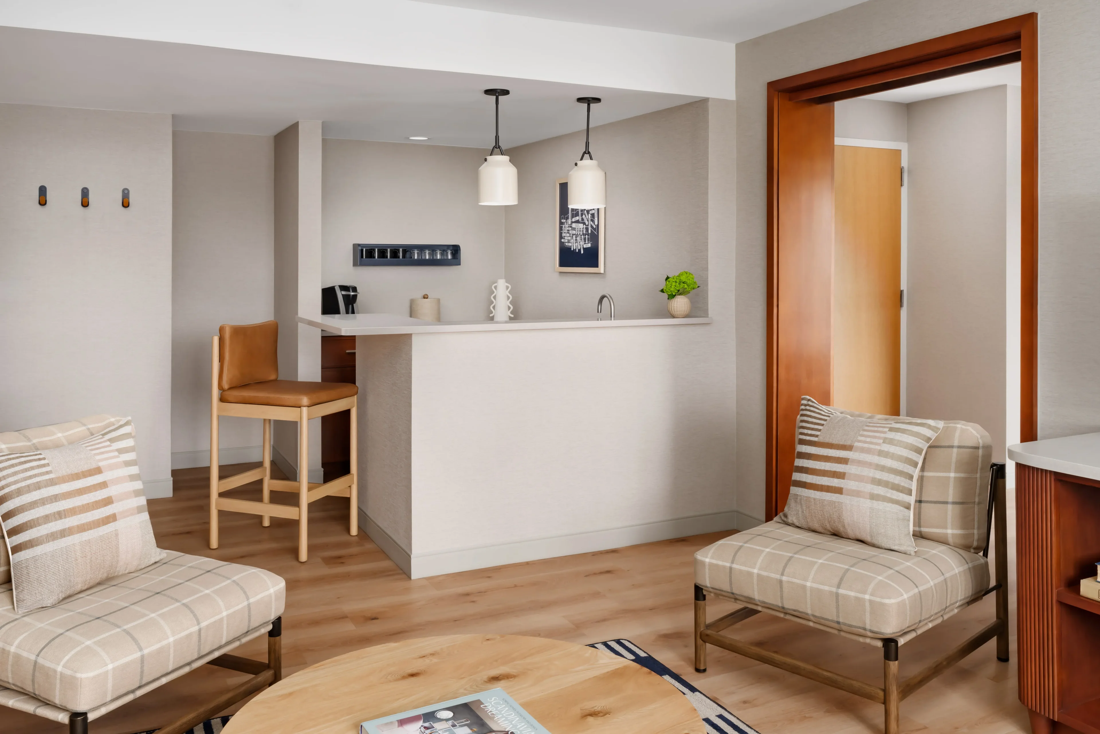Modern living room with bar and seating.