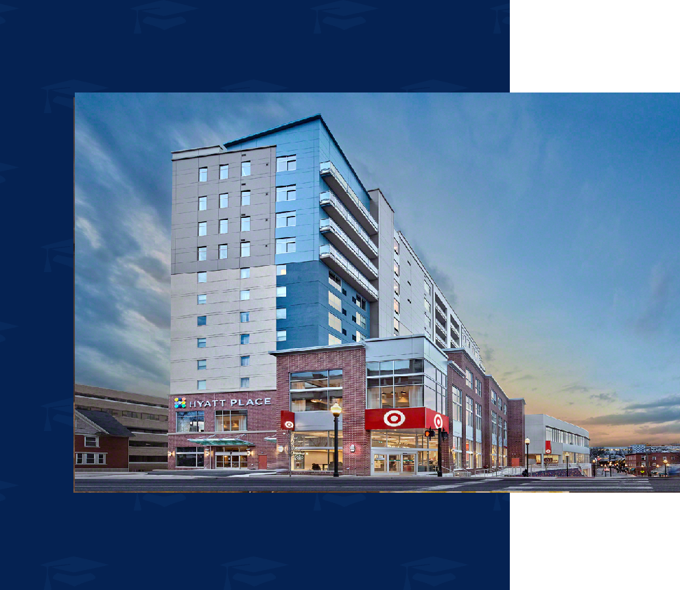 Modern building with hotel and retail stores.