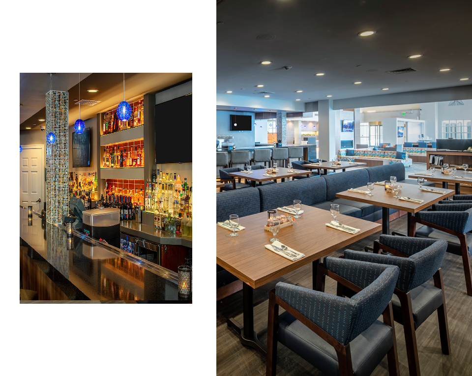 Modern restaurant interior with bar and tables.